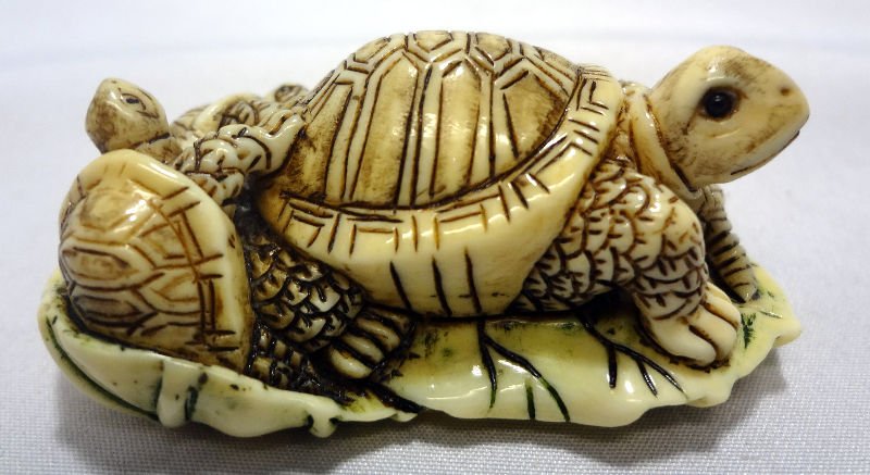 Chinese Ivory Nest of Turtle Netsuke: Chinese Ivory Nest of Turtle Netsuke. Measures 1" high.For Domestic or International Shipping Quotes Please Feel Call Ryan or Dave at Eagle Shipping Center 561-932-0700 or email them at ryan@eagleship
