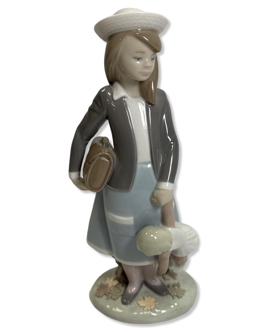 Lladro 5218 Autumn Porcelain Figurine: Lladro 5218 Autumn Porcelain Figurine measures H: 8 1/4" x W: 3 1/4"