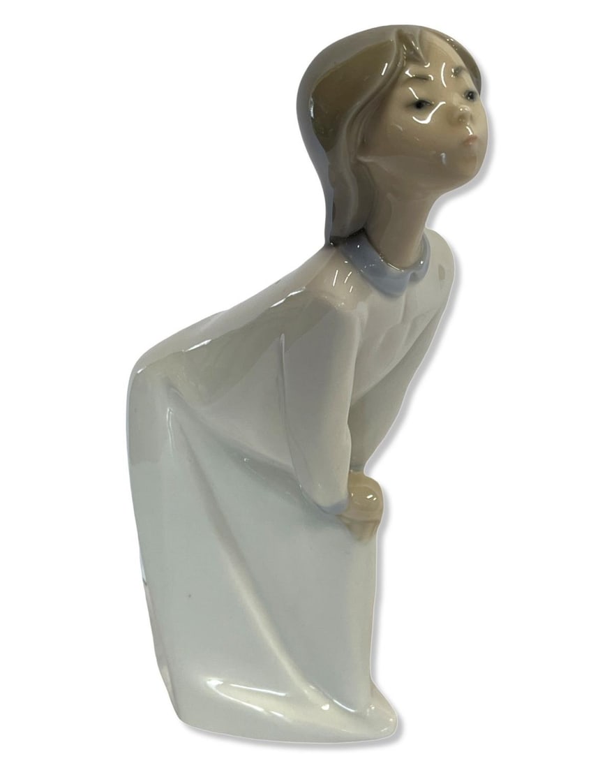Lladro #4873 Girl Kissing Porcelain Figure: Lladro #4873 Girl Kissing Porcelain Figure measures H: 7"