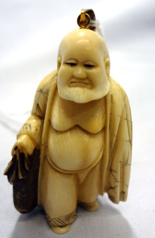 Chinese Ivory Netsuke with Gold Bale: Chinese Ivory Netsuke with Gold Bale. Measures 2" high.For Domestic or International Shipping Quotes Please Feel Call Ryan or Dave at Eagle Shipping Center 561-932-0700 or email them at ryan@eagleship