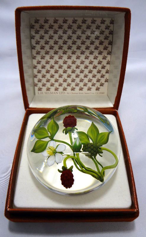 Gordon Smith Glass Paperweight, 1991: Gordon Smith Glass Paperweight, 1991 featuring magnificent dogwood blossoms and red berries on a clear ground. Signed GS 1991. Diameter 3 1/8".For Domestic or International Shipping Quotes Please Feel