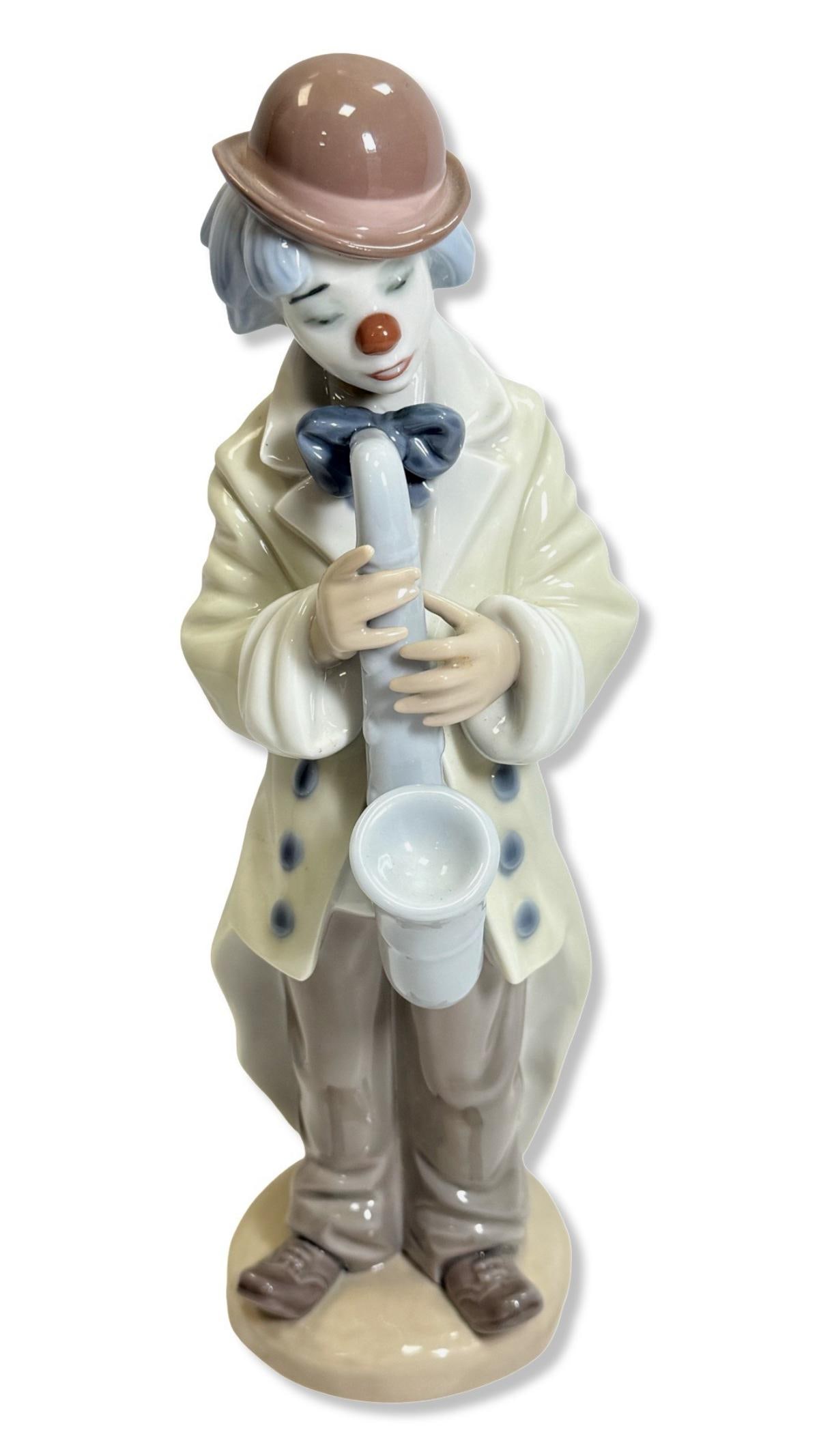 Lladro 5471 Sad Sax Porcelain Figurine: Lladro 5471 Sad Sax Porcelain Figurine measures H: 9" x W: 3"