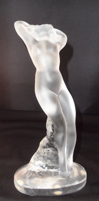 Lalique Crystal Figure "Arms Up": Lalique Crystal Figure "Arms Up". Depicting frosted figure leaning on a clear rock. Signed Lalique France. Measures - Height - 9 1/2", Width - 4 1/2", Length - 3 1/4". For Domestic or International Sh