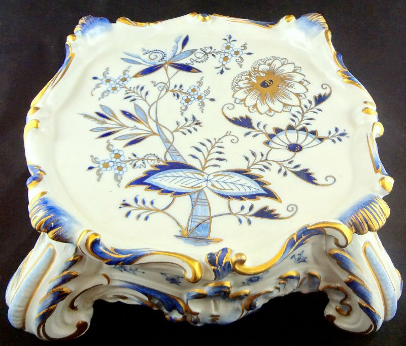 Meissen Hand Painted Porcelain Stand: Meissen Hand Painted Porcelain Stand with painted flowers and gilt scrolls throughout. Blue cross swords mark on bottom. Measures 3 3/4" high x 9 1/2" wide.For Domestic or International Shipping Quote