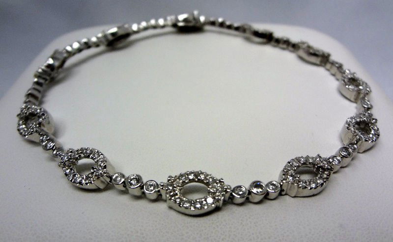 Contemporary Diamond Bracelet: Contemporary diamond bracelet featuring a sectional design studded with 148 round brilliant cut diamonds weighing approx. 3.00cts in a stylized open oval link designed 18K white gold mounting weighing