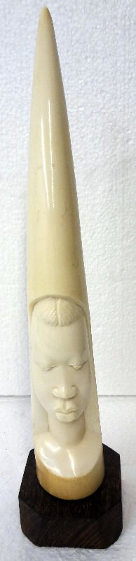 African Figural Carved Ivory Tusk: African Figural Carved Ivory Tusk. Measures 14 3/4" high, base - 1 1/2".For Domestic or International Shipping Quotes Please Feel Call Ryan or Dave at Eagle Shipping Center 561-932-0700 or email them 