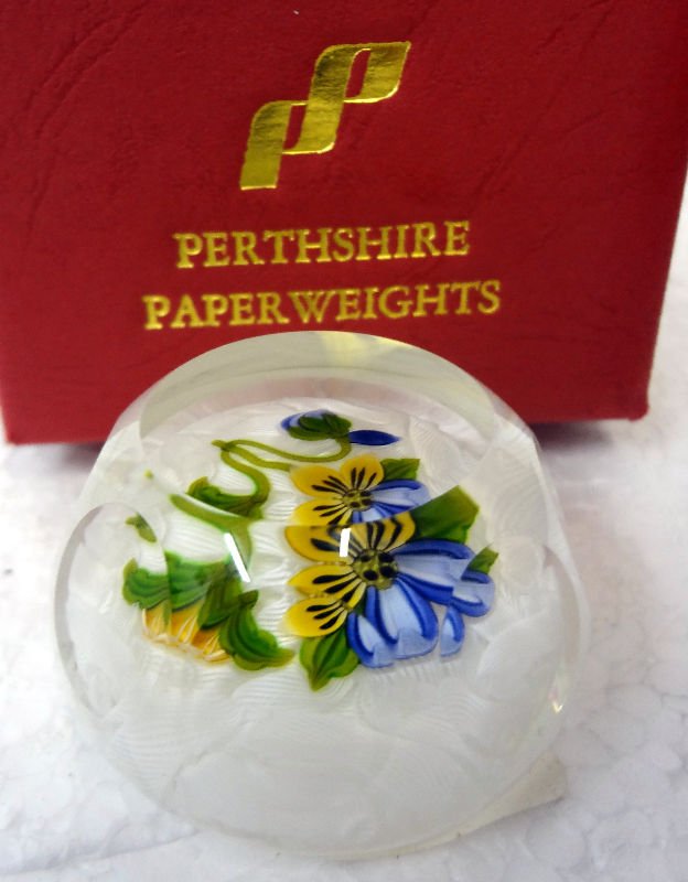 Perthshire Pansy Flower Paperweight: A delicate amethyst and yellow pansy weight set on a lace background with top facet and eight side facets. Issue 400. Measures 2 1/8" diameter.For Domestic or International Shipping Quotes Please Feel