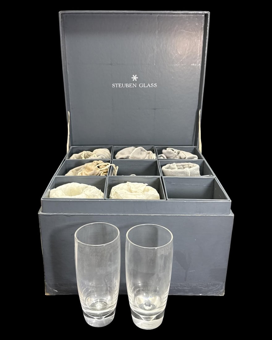 Lot of Nine Steuben Crystal Teardrop Highball Glasses: Lot of Nine Steuben Crystal Teardrop Highball Glasses measures H: 6 3/8" x DIA: 2 3/4". Six have original dust covers and box