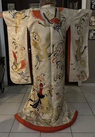 The product is a genuine silk kimono that has been hand-sewn and hand-embroidered with gold threads