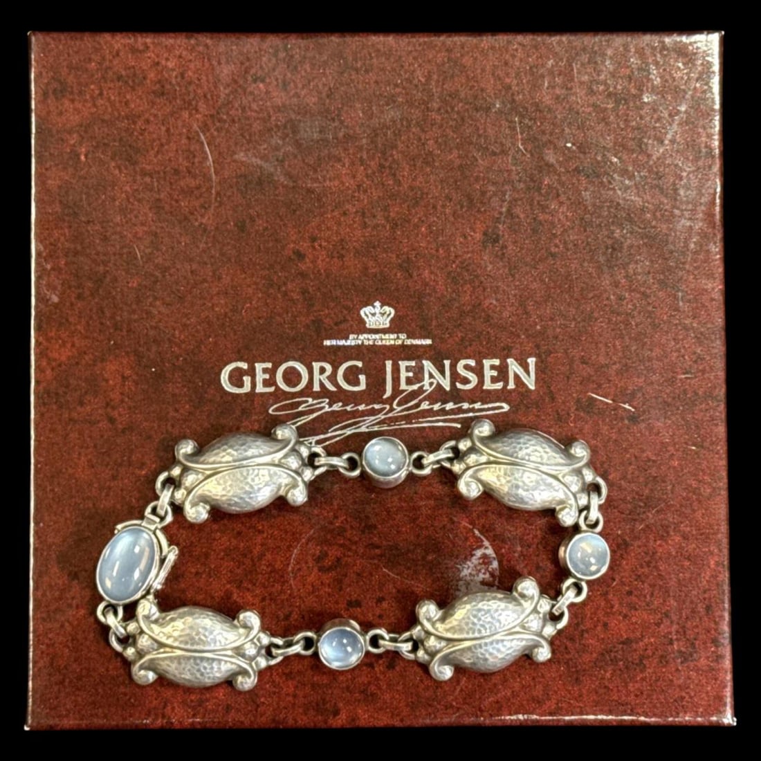 Georg Jensen Denmark Sterling Silver & Moonstone Floral Motif Bracelet: Georg Jensen Denmark Sterling Silver & Moonstone Floral Motif Bracelet measures DIA: 3 1/2", weighs 0.59OZT. Includes original box
