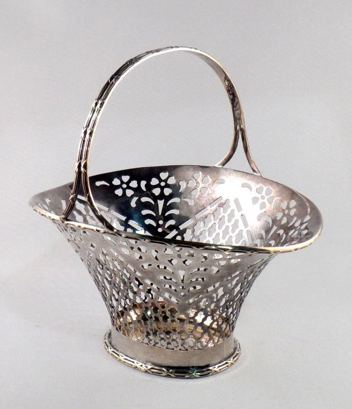 Marshallfield & Co Sterling Silver Basket: Marshall Field & Co sterling silver reticulated basket no. 673S hallmarked 5 1/2" height x 5 3/4" x 4 1/2", weighs 4 toz.For Domestic or International Shipping Quotes Please Feel Call Ryan or Dave at 