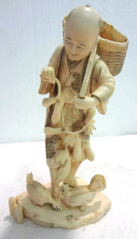Chinese Carved Ivory Figural Group with Hens: Chinese Carved Ivory Figural Group with Hens. Depicting man carrying sack over his back with hens at his feet. Measures 7 5/8" high.For Domestic or International Shipping Quotes Please Feel Call Ryan 