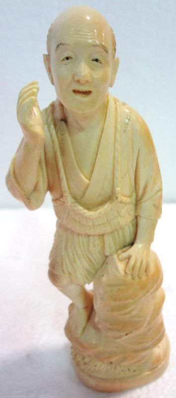 Antique Japanese Carved Ivory Figure of Man: Antique Japanese Carved Ivory Figure of Man. Stamp on bottom. Measures 7 1/4" high.For Domestic or International Shipping Quotes Please Feel Call Ryan or Dave at Eagle Shipping Center 561-932-0700 or 