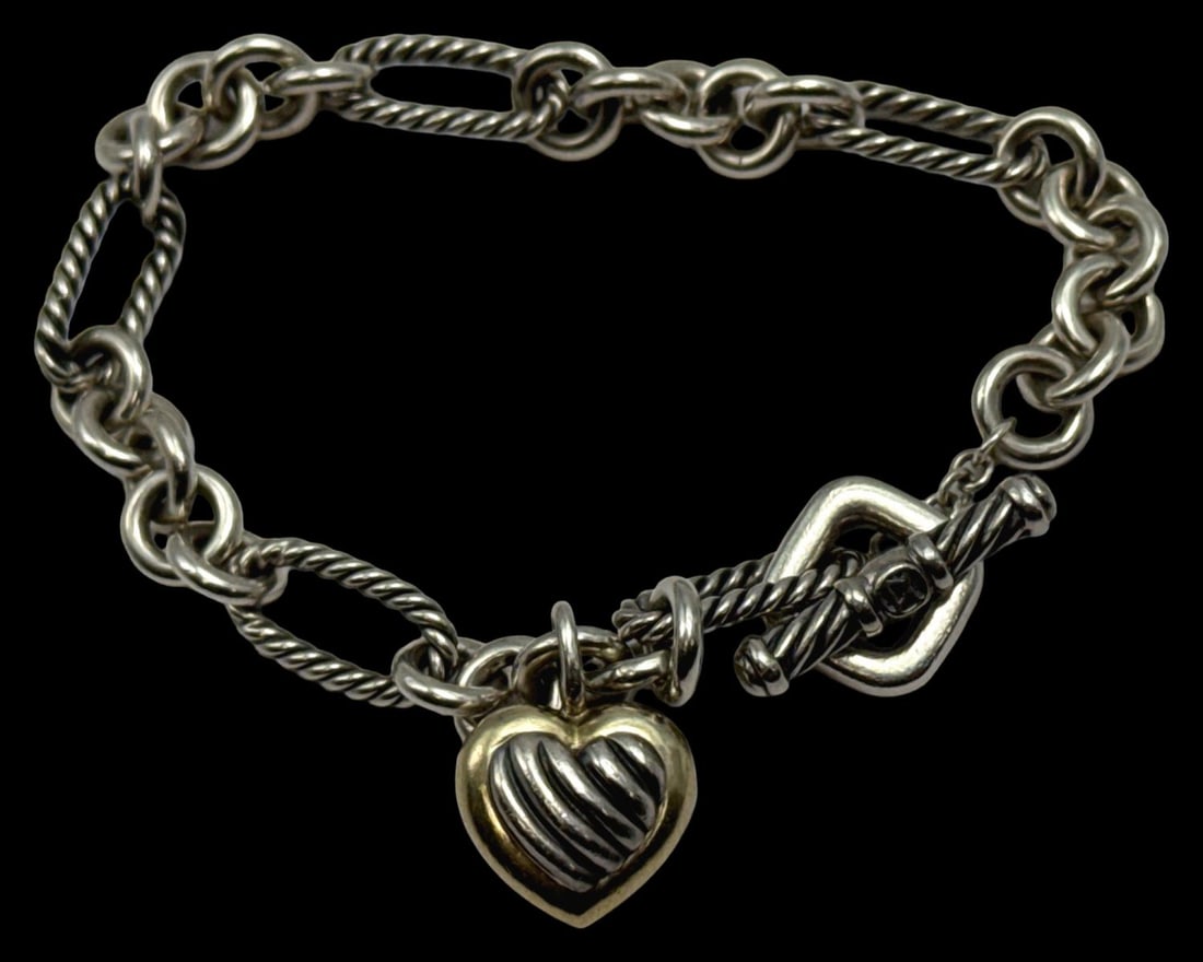 David Yurman Sterling Silver & 18kt YG Charm Bracelet: David Yurman Sterling Silver & 18kt YG Charm Bracelet. Stamped 925 750, measures DIA: 3", weighs 0.72 OZT
