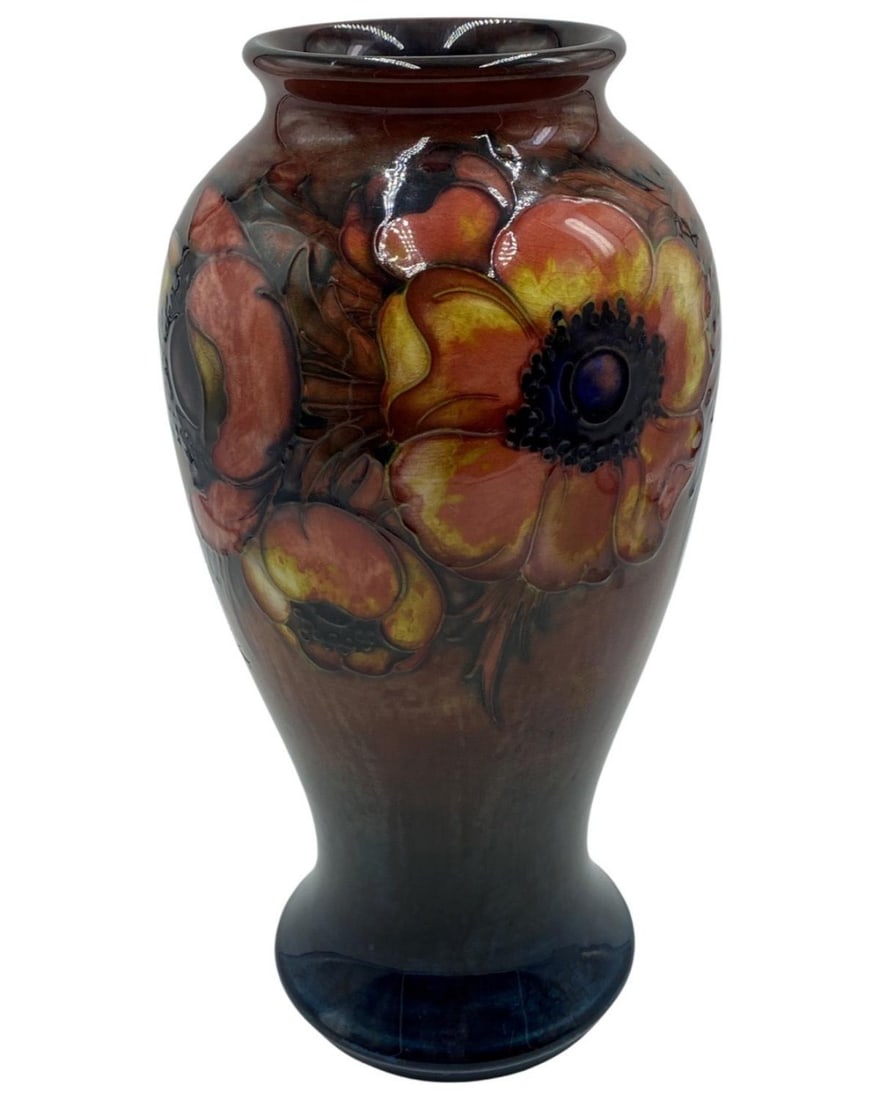 Signed William Moorcroft Burslem Flambe Poppy Pattern Vase: Signed William Moorcroft Burslem Flambe Poppy Pattern Vase (Circa. 1930) of a Baluster form, the poppies against a flambe red/blue. Ground blue signature, measures H: 11 1/2"