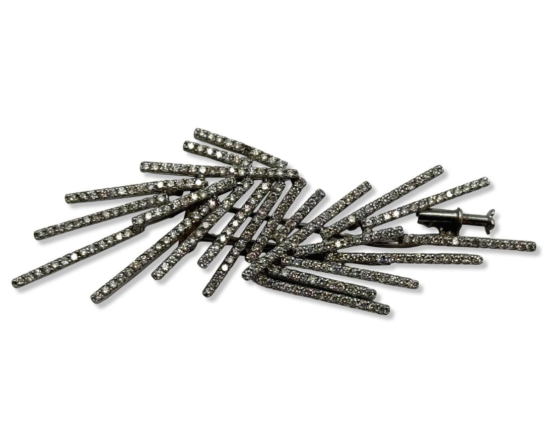 18kt WG & Diamond Freeform Brooch: 18kt WG & Diamond Freeform Brooch measures L: 1" x W: 2 7/8", weighs 8.2dwt