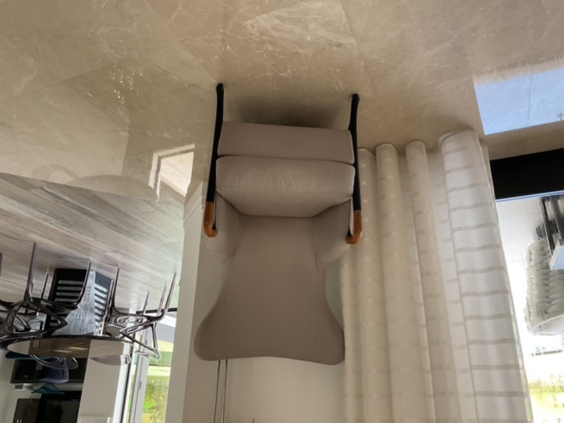 Beige Tone Upholstered Chair with Black and Wood Accents: Beige Tone Upholstered Chair with Black and Wood Accents. Original retail price of $4,120.00