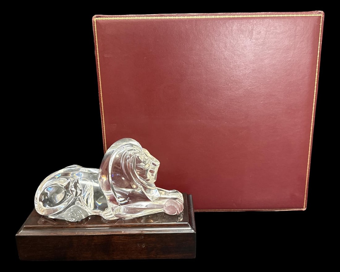 Steuben Glass Lloyd Atkins Seated Lion Sculpture with Base: Steuben Glass Lloyd Atkins Seated Lion Sculpture with Base. Lion measures H: 4 1/8" x W: 8 1/8", base measures H: 2 3/8" x W: 9 1/2". Includes original presentation box