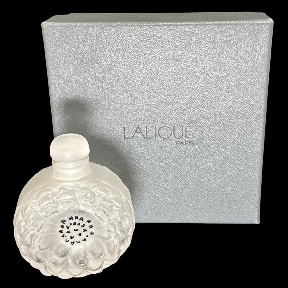 Lalique France Crystal Dahlia Perfume Bottle: Lalique France Crystal Dahlia Perfume Bottle measures H: 3 1/2" x W: 2 3/4". Includes original box