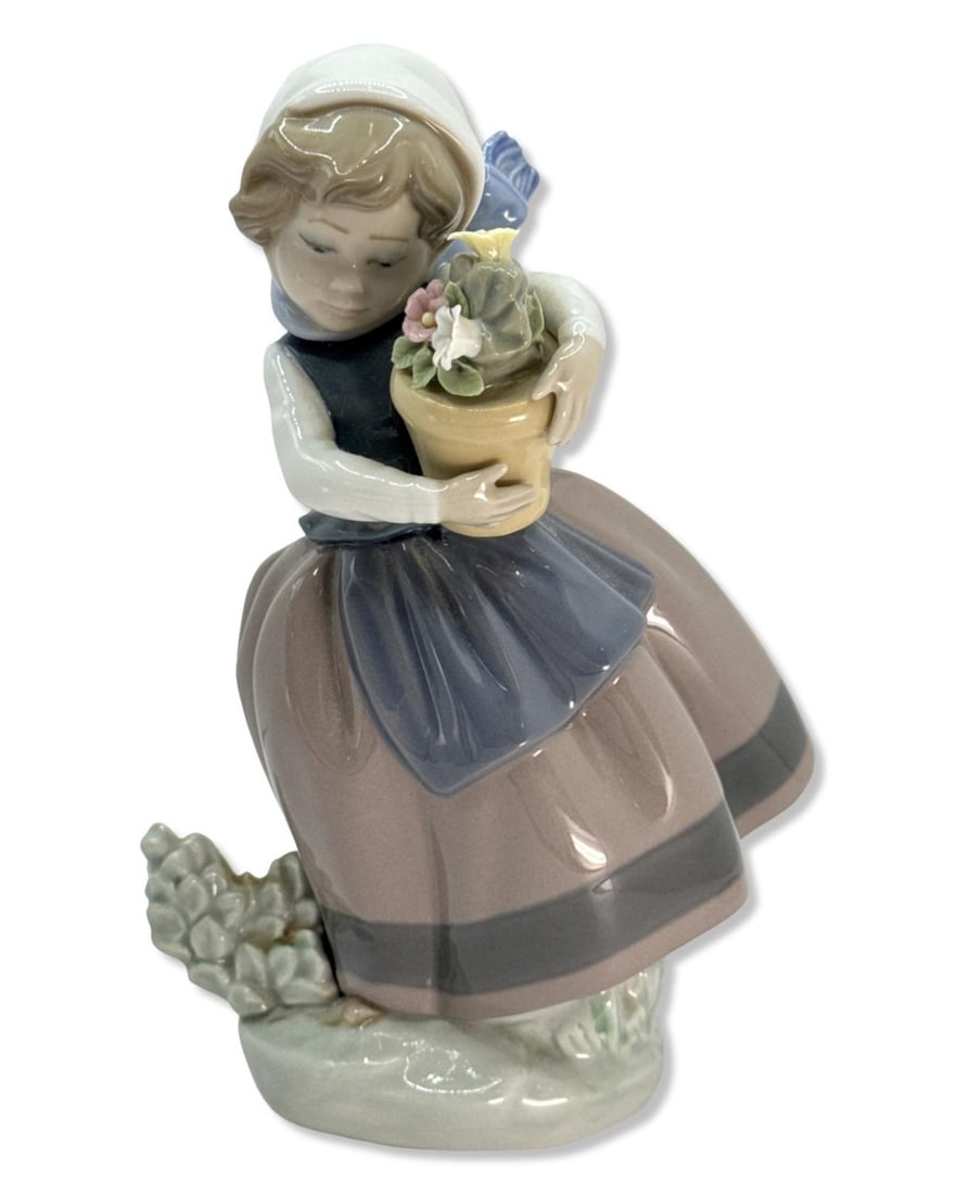 Lladro 5223 Spring is Here Porcelain Figurine: Lladro 5223 Spring is Here Porcelain Figurine measures H: 6 3/4" x W: 4 1/2"