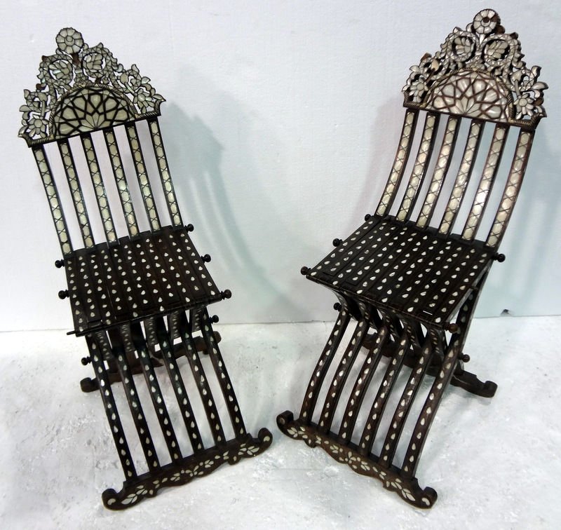 Pair of Antique Moroccan Mother of Pearl Folding Chairs: Pair of Antique Moroccan Mother of Pearl Folding Chairs. Measures - 38" high x 16 1/2" wide. For Domestic or International Shipping Quotes Please Feel Call Ryan or Dave at Eagle Shipping Center 561-93