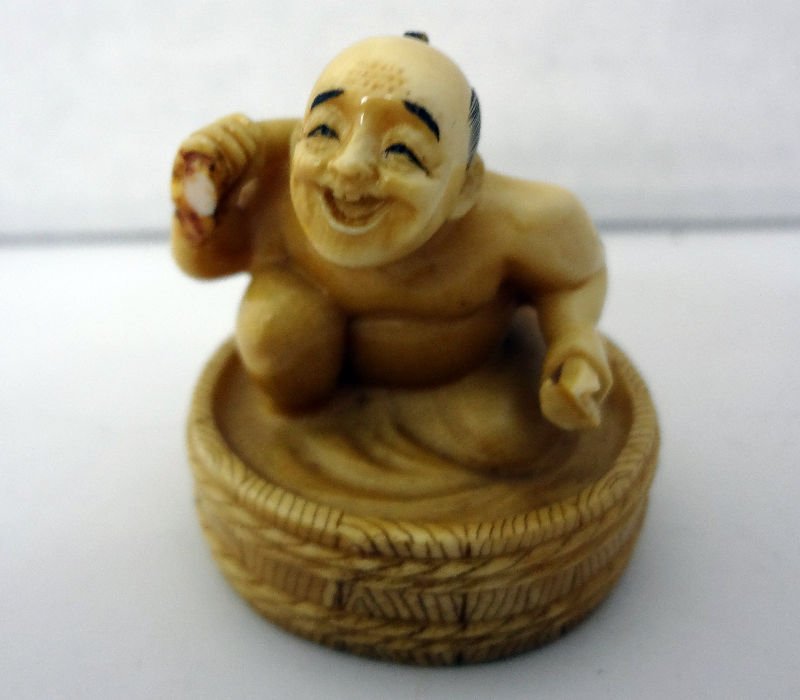 Chinese Ivory Netsuke of Man Taking Bath: Chinese Ivory Netsuke of Man Taking Bath. Measures - 2" high x 1 1/2" wide. For Domestic or International Shipping Quotes Please Feel Call Ryan or Dave at Eagle Shipping Center 561-932-0700 or email t