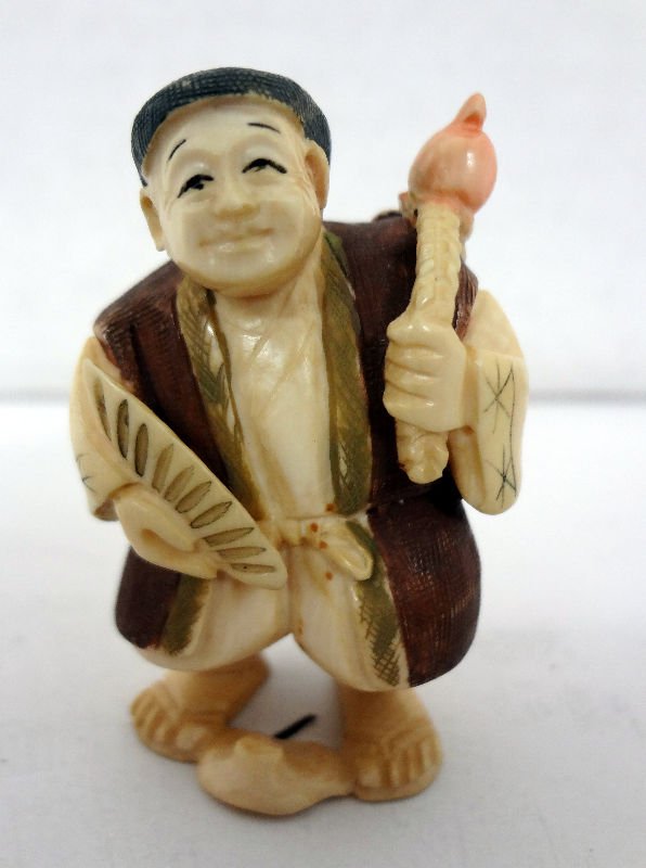 Chinese Polychrome Netsuke a Man Holding Fan: Chinese Polychrome Netsuke a Man Holding Fan. Measures - 2" high. For Domestic or International Shipping Quotes Please Feel Call Ryan or Dave at Eagle Shipping Center 561-932-0700 or email them at rya