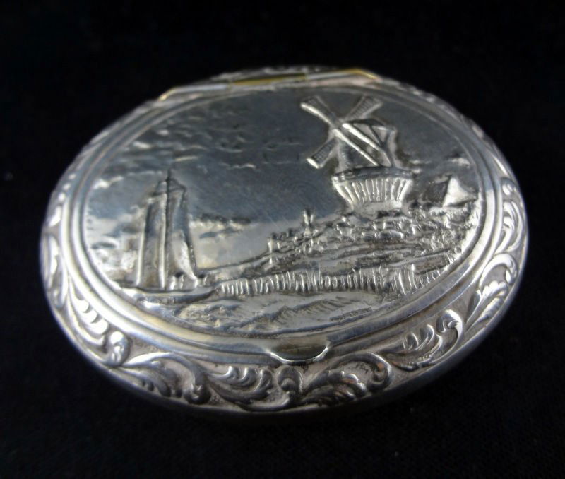 Silver Plated Pill Box Depicting Sail Boat & Windmill: Silver Plated Pill Box Depicting Sail Boat & Windmill Beach Scene. Measures - 2 1/2" wide. For Domestic or International Shipping Quotes Please Feel Call Ryan or Dave at Eagle Shipping Center 561-932-