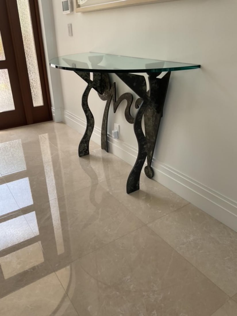 Half Moon Glass Console Table with Sculptured Base in Coppered Finish: Half Moon Glass Console Table with Sculptured Base in Coppered Finish 54" x 24". Original retail price of $6,366.00