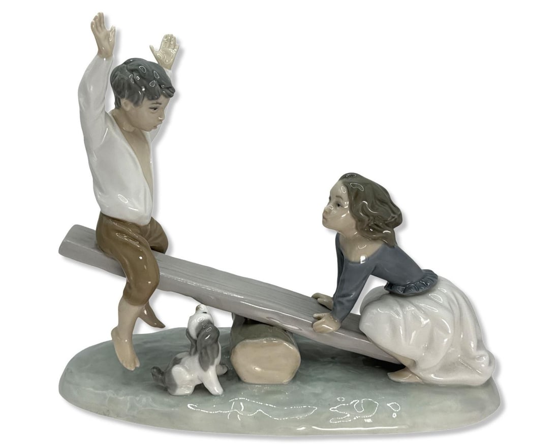 Lladro 4867 Seesaw Porcelain Figurine: Lladro 4867 Seesaw Porcelain Figurine measures H: 7 3/4" x W: 9 1/4"
