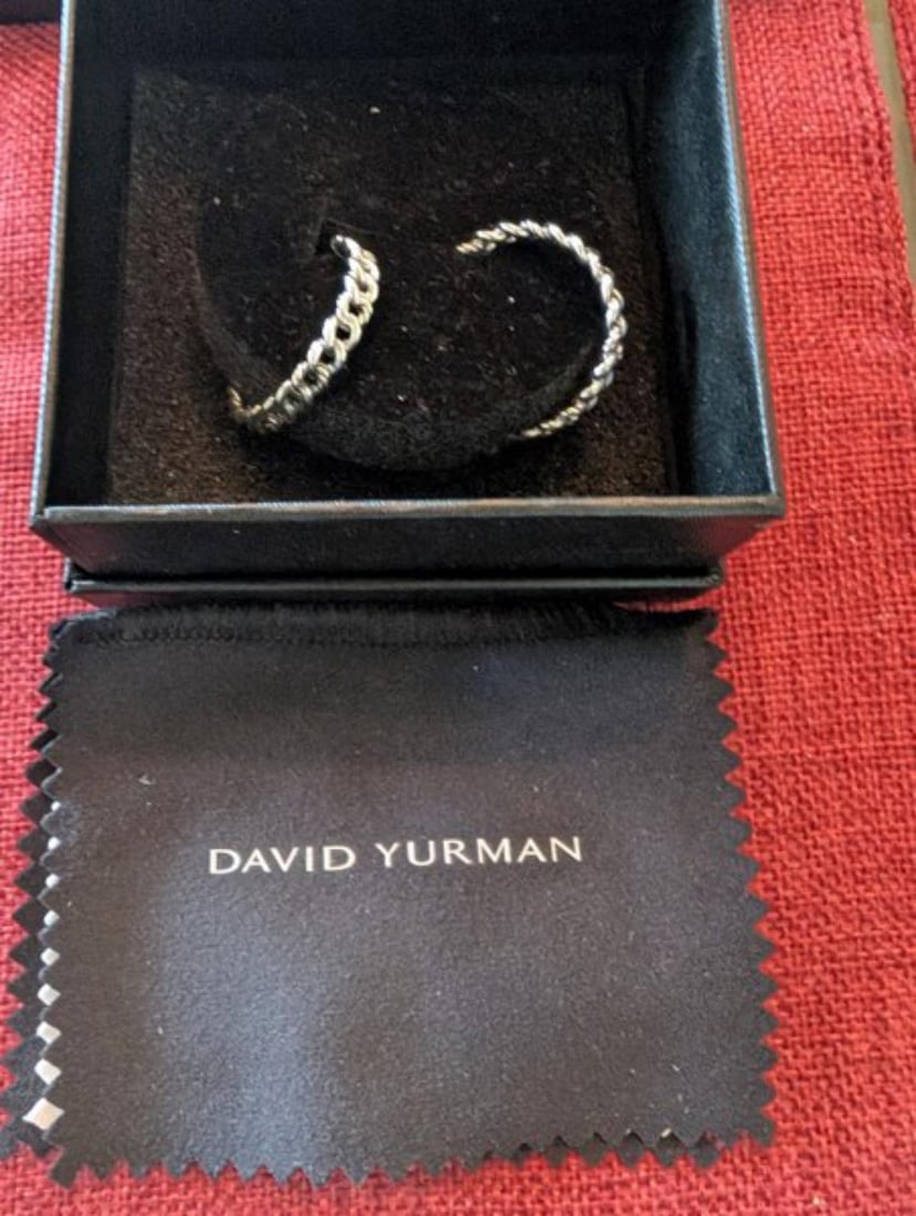 Offered is a pair of authentic David Yurman sterling silver cable hoop earrings featuring the: Offered is a pair of authentic David Yurman sterling silver cable hoop earrings featuring the designer's iconic twisted cable motif. These elegant earrings showcase the timeless style and craftsmanshi