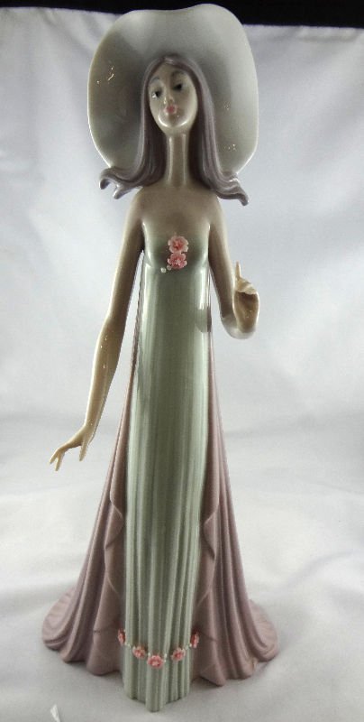Lladro Figurine "The Debatante": Lladro Figurine "The Debatante". Artist - Jose Puche, Retired - 1998, Retail - $495, Measures - 13 3/4" high.