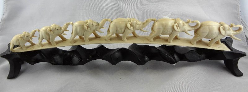 African Hand Carved Ivory Tusk Depicting Elephants: African Hand Carved Ivory Tusk Depicting Elephants. Measures - 12" high x 3" wide.