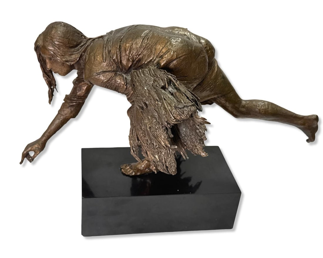 Bruno Lucchesi (Italian, b. 1926) Bronze Sculpture of a Woman Gathering on Black Base: Bruno Lucchesi (Italian, b. 1926) Bronze Sculpture of a Woman Gathering on Black Base. Figure measures H: 8" x W:16", base measures H: 2 3/4" x W: 8 3/4" x L: 4 5/8"