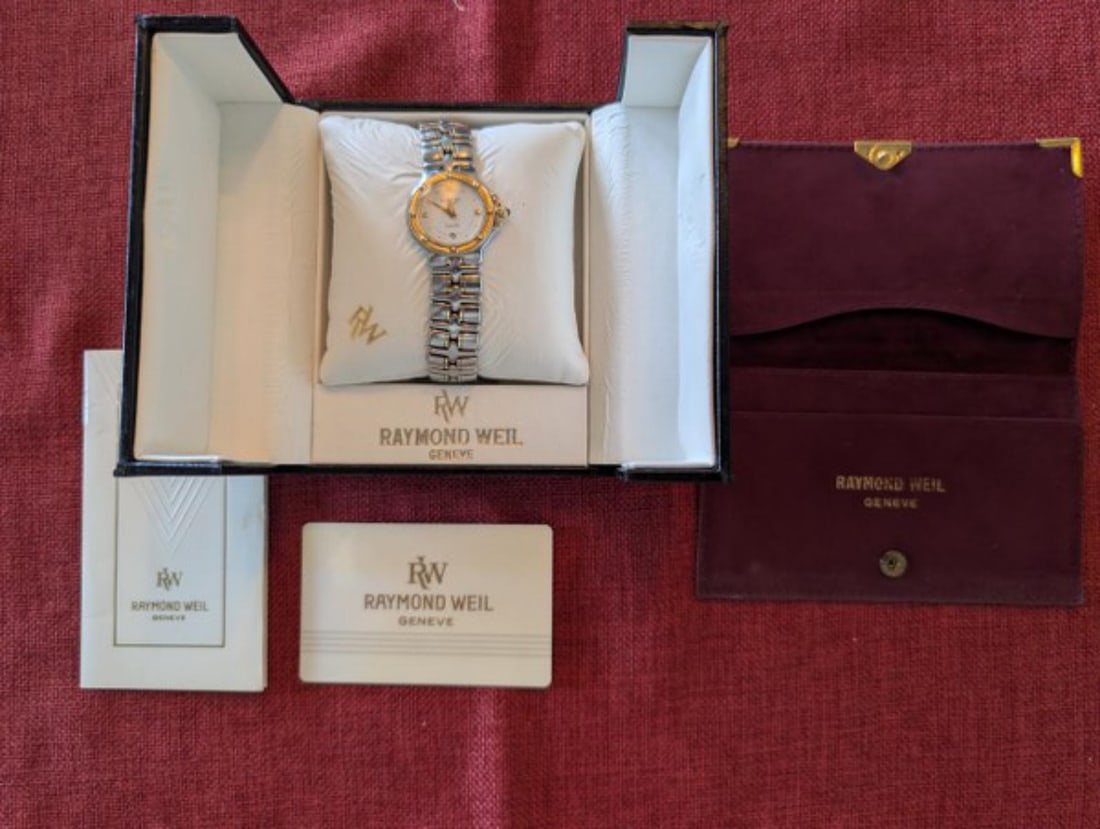 Authentic Raymond Weil Parsifal Ladies Swiss Quartz Wristwatch with Box and Papers: Authentic Raymond Weil Geneve Parsifal ladies wristwatch featuring a Swiss quartz movement, two-tone stainless steel and gold-tone construction, white dial with Roman numeral hour markers, date displa