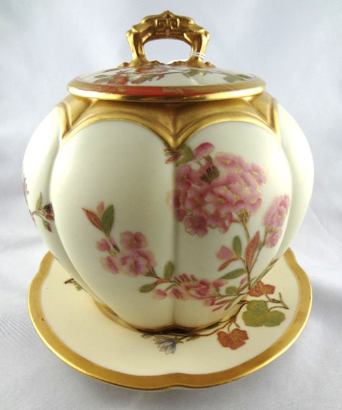 Royal Worcester Covered Biscuit Jar: Royal Worcester Covered Biscuit Jar. Melon shaped floral Royal Worcester biscuit , floral design with gold accents. Measures - 7 1/2" high x 7" wide.