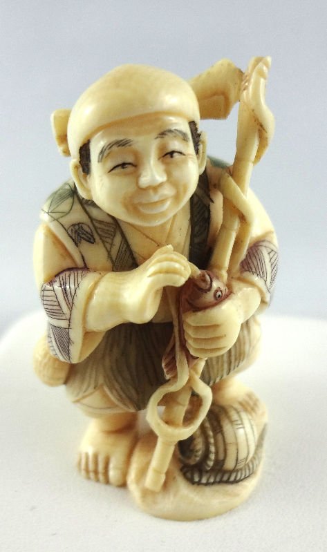 Chinese Hand Carved Ivory Netsuke: Chinese Hand Carved Ivory Netsuke. Man with fishing pole.