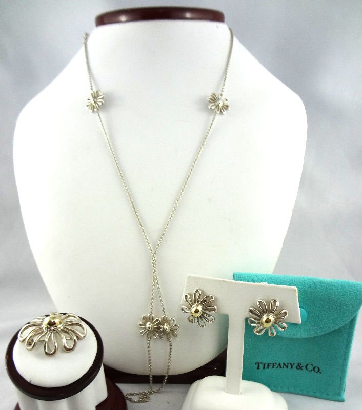 Tiffany & Co. Paloma Picasso "Flower" Sterling Set: Tiffany & Co. Paloma Picasso "Flower" Sterling Set consisting of a necklace, earrings and a pendant. Pendant and earrings have 18Kt gold accented center with pouch marked Paloma Picasso Tiffany & Co. 