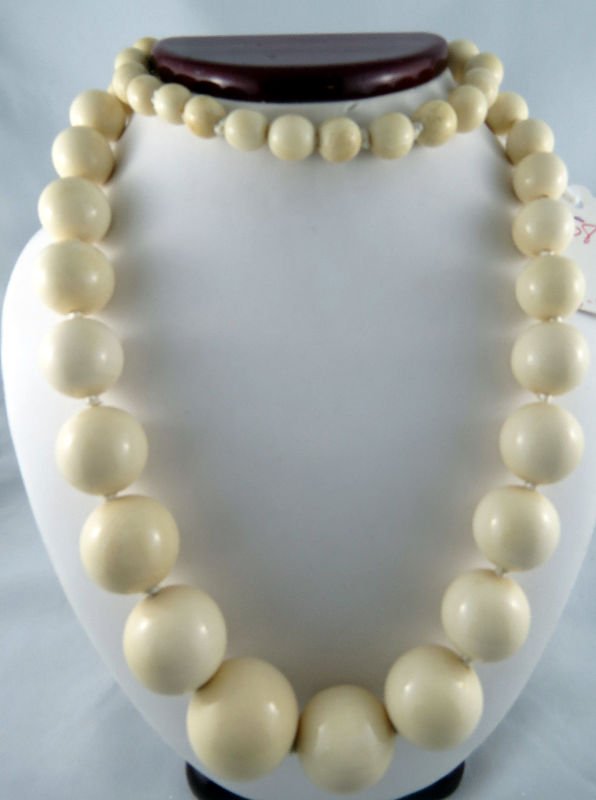Genuine Hand Carved Ivory Ball Necklace: Genuine Hand Carved Ivory Ball Necklace in graduated widths. Measures - 32" in length. Ivory balls range from 10-28mm. Weight 226.8 grams.