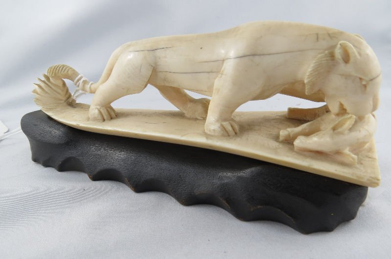 African Hand Carved Ivory Lion: African Hand Carved Ivory Lion. Measures - 7 1/8" long x 3 1/4" high. For Domestic or International Shipping Quotes Please Feel Call Ryan or Dave at Eagle Shipping Center 561-932-0700 or email them at