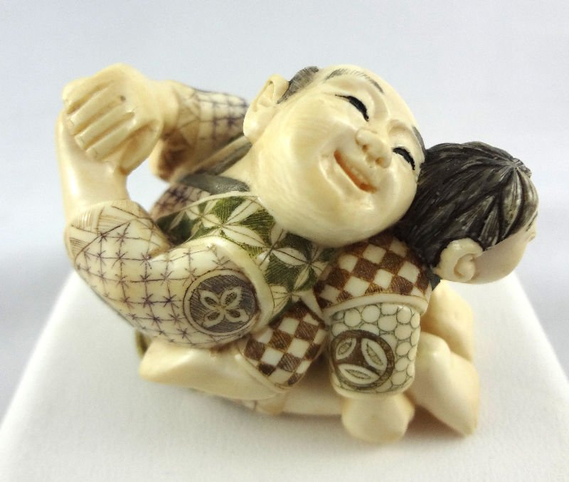 Chinese Hand Carved Ivory Netsuke Group: Chinese Hand Carved Ivory Netsuke Group. Measures - 1 5/8" high.