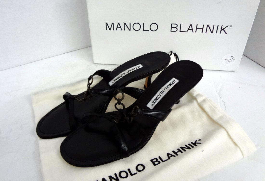Manolo Blahnick Black Calf Leather Sandals: Manolo Blahnick Black Calf Leather Sandals with metal ring design. Made in Italy, retail value - $515.00, size 38. Original pouch and box. Conditon never worn.