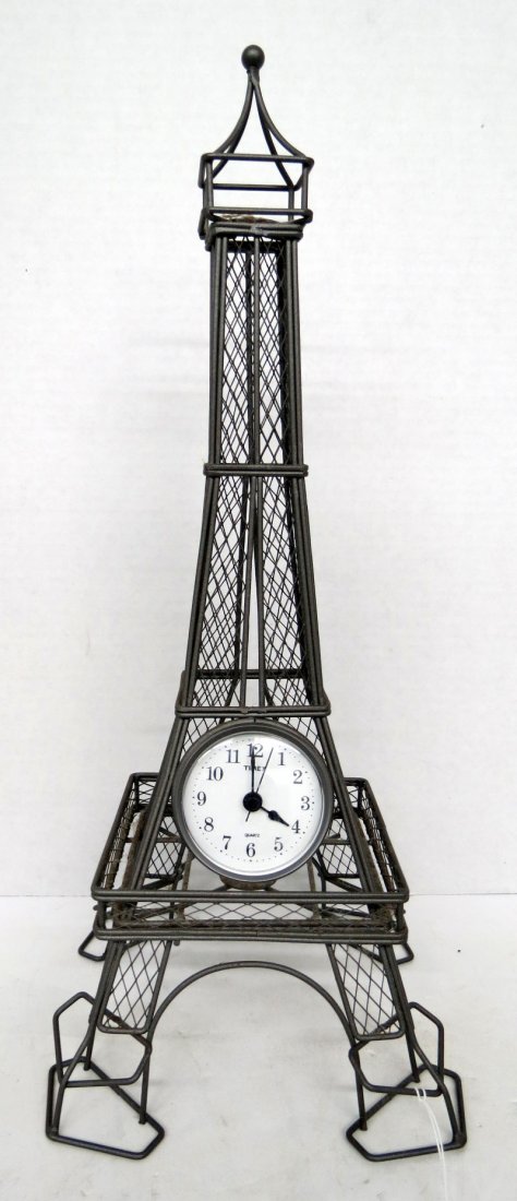 Timex Quartz Eiffel Tower Sculpture: Timex Quartz Eiffel Tower Sculpture shaped metal bass. Measures - 17 1/4" high x 8" wide. For Domestic or International Shipping Quotes Please Feel Call Ryan or Dave at Eagle Shipping Center 561-932-0