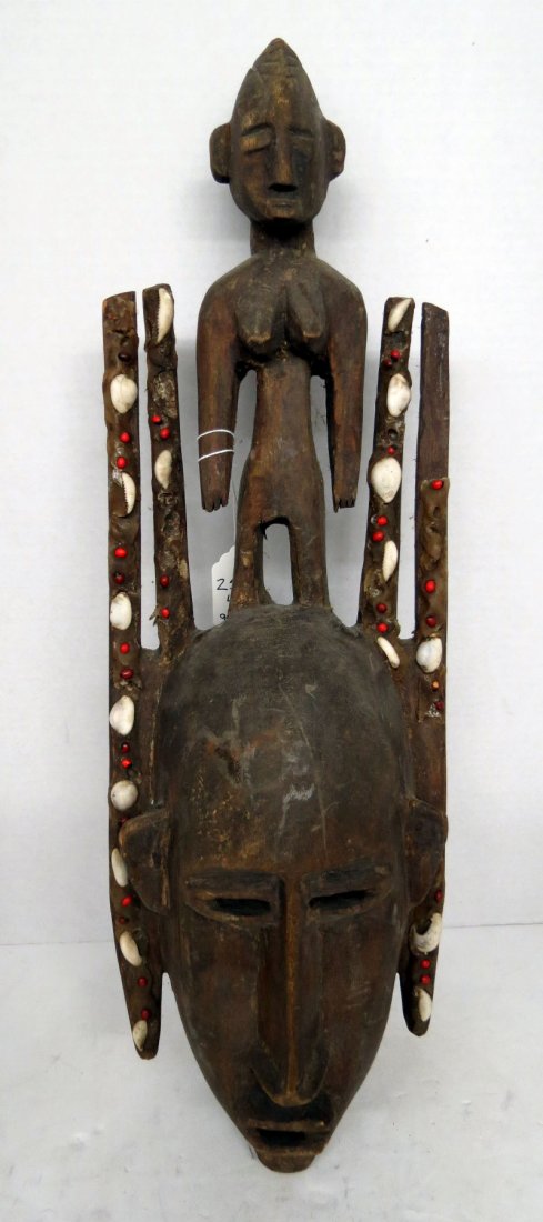African Tribal Hand Carved Mask: African Tribal Hand Carved Mask. Measures - 21" high x 7" wide.