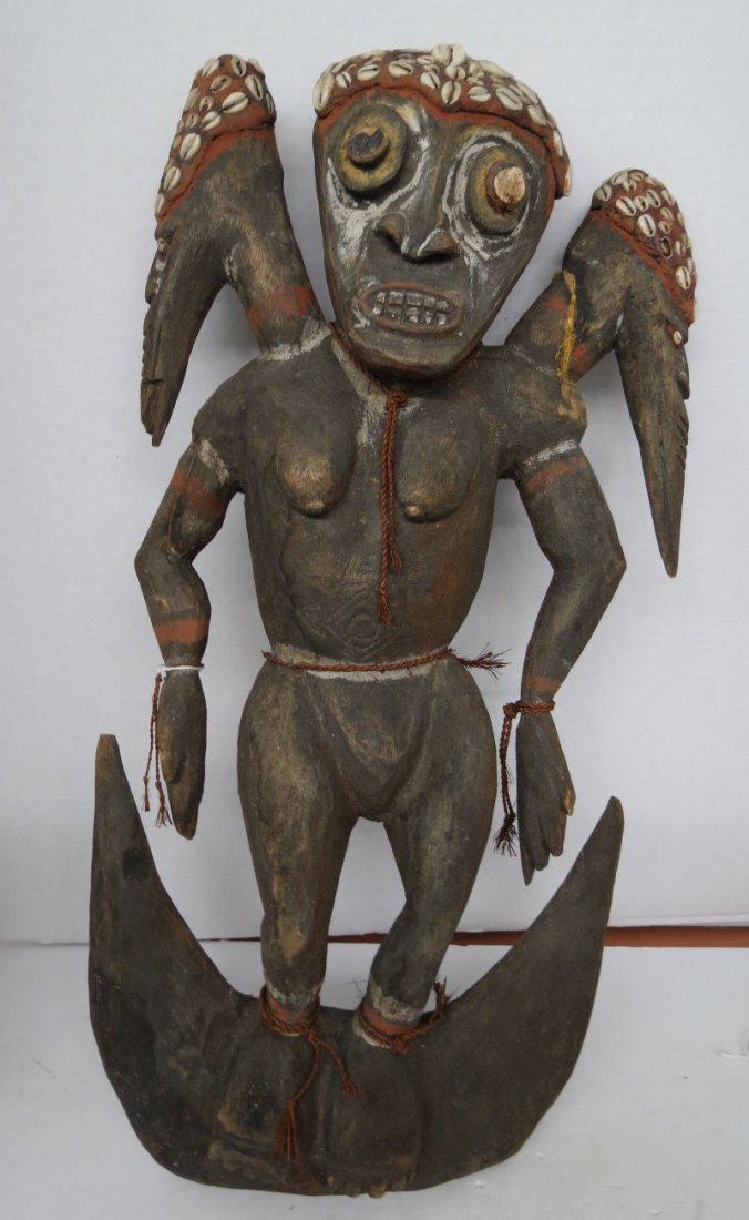 African Hand Carved Figure: African Hand Carved Figure. Measures - 23 1/2" high x 10 3/4" wide.
