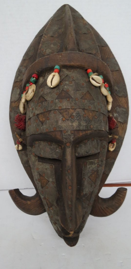 African Hand Carved Mask: African Hand Carved Mask. Measures - 20" high x 13" wide.