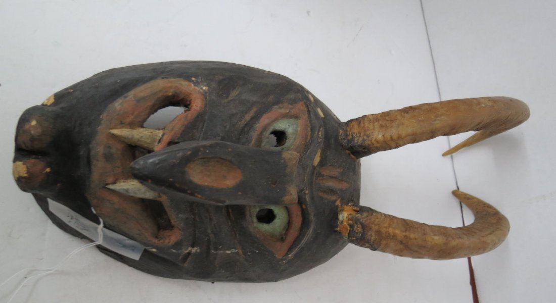 African Hand Carved Mask: African Hand Carved Mask. Measures - 17" long x 7 1/4" wide.