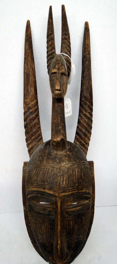 African Hand Carved Mask: African Hand Carved Mask. Measures - 23" long x 11" wide.