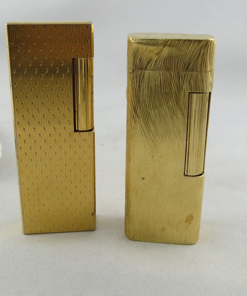 Pair of Dunhill Lighters: Pair of Dunhill Lighters. Measures - 2 3/4" high.
