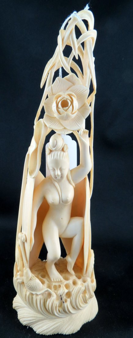 Indian Hand Carved Ivory Erotic Figure: Indian Hand Carved Ivory Erotic Figure, depicting fish & a floral design. Measures - 9" high.